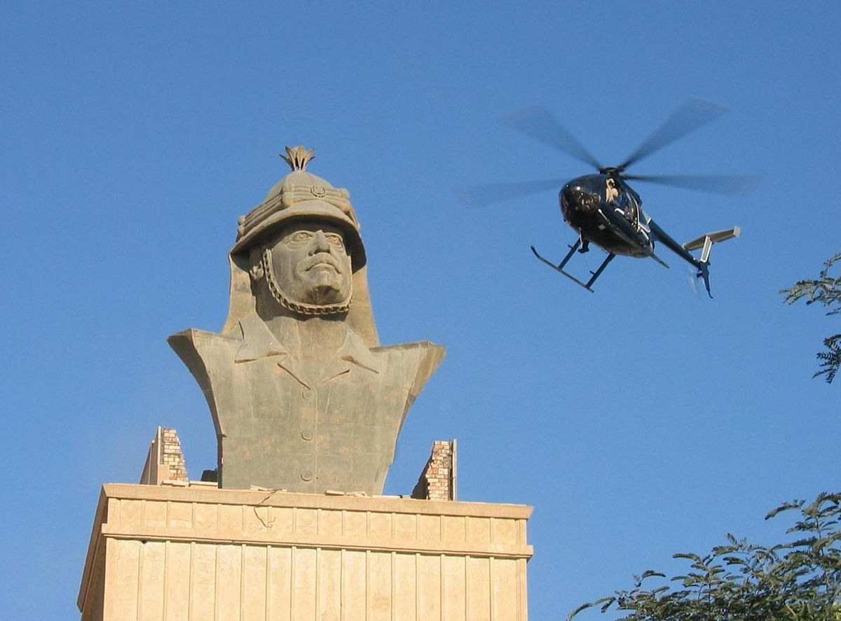 A Blackwater Little Bird Helicopter flies over the Republican Palace in Baghdad, December 2007. Photo: jamesdale10 (CC 2.0)