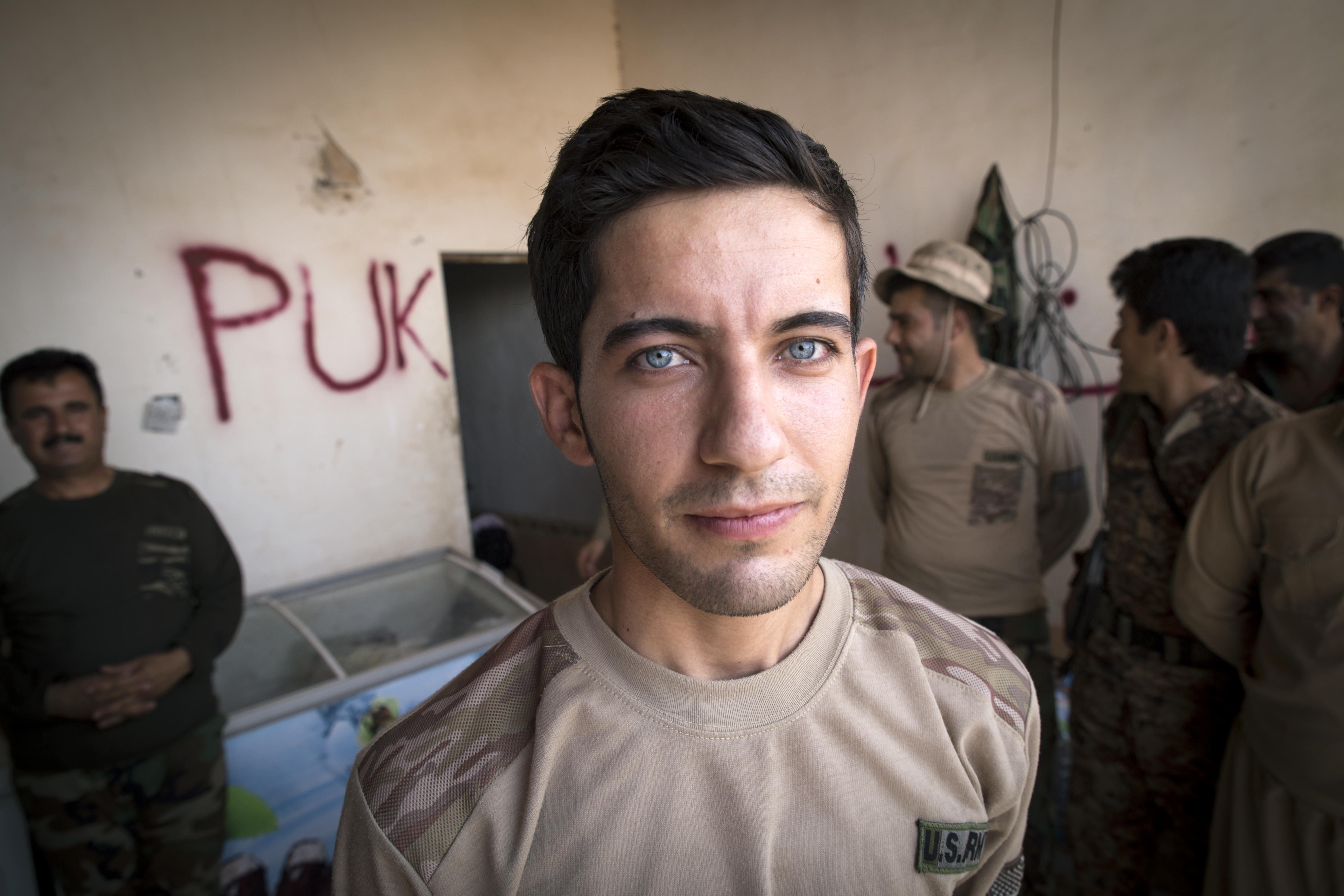 Peshmerga fighter Chewan, 22, bought his ‘US Army’ outfit in the local bazar in Koya. Most fighters have to pay for their own outfits.