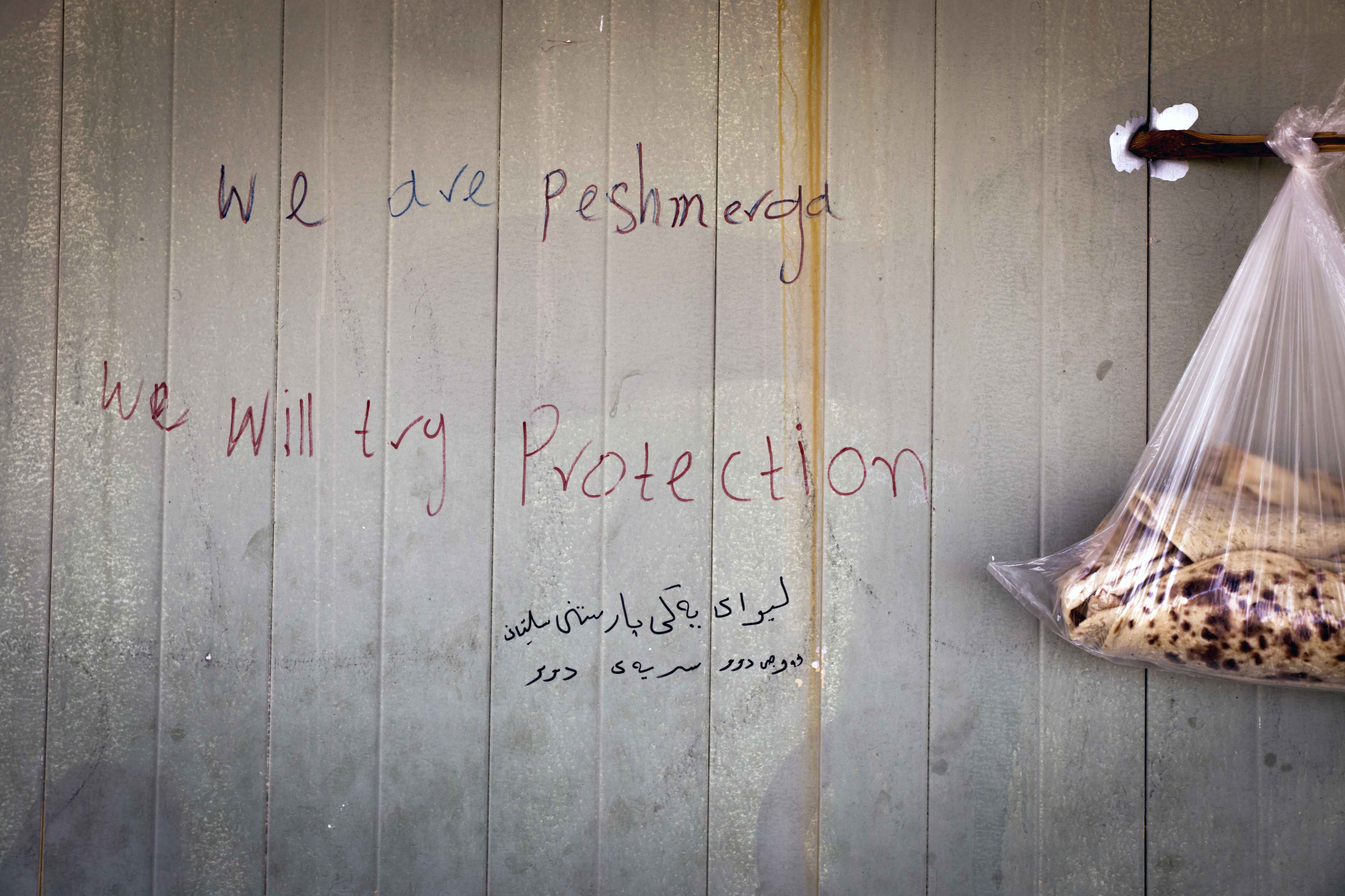 Writing on a building just behind the frontline.