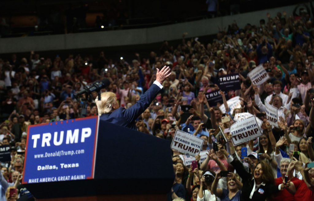 Donald Trump greets the crowd before speaking at a rally in Dallas, TX.